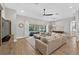 Open-concept living area leading to a screened-in patio with a pool view at 12928 Twin Bridges Dr, Riverview, FL 33579
