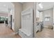 A mud room featuring a bench and hanging hooks and a laundry room at 12928 Twin Bridges Dr, Riverview, FL 33579