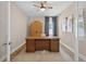 Home office with hardwood floors, a ceiling fan, a wooden desk and natural light at 12928 Twin Bridges Dr, Riverview, FL 33579