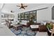 Expansive patio with outdoor seating area perfect for relaxing and entertaining with ceiling fans at 12928 Twin Bridges Dr, Riverview, FL 33579