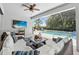 Relaxing screened patio with comfortable seating area overlooking the beautiful pool at 12928 Twin Bridges Dr, Riverview, FL 33579