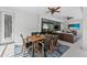 Covered patio featuring ceiling fans, an outdoor kitchen and dining area, plus a lounge area at 12928 Twin Bridges Dr, Riverview, FL 33579