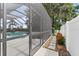 Enjoy this screened pool area with outdoor seating, perfect for relaxation and entertaining at 12928 Twin Bridges Dr, Riverview, FL 33579