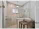 Luxurious walk-in shower with a rainfall showerhead and tiled walls at 12928 Twin Bridges Dr, Riverview, FL 33579
