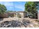 Backyard displaying partial privacy fence, vegetation and small yard at 1432 San Juan Ct, Clearwater, FL 33756