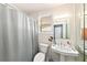 Standard bathroom featuring a pedestal sink, toilet and shower with window light at 1432 San Juan Ct, Clearwater, FL 33756