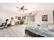 Bright bedroom with tile floors, fan, and sliding glass doors for natural light, offering a relaxing space at 1432 San Juan Ct, Clearwater, FL 33756