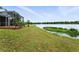 Expansive backyard with screened patio area and stunning lake views at 1725 Bondurant Way, Brandon, FL 33511