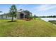 Backyard with screened lanai overlooking the lake at 1725 Bondurant Way, Brandon, FL 33511