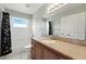 Well-maintained bathroom with granite counters and white tiled shower and floors at 1725 Bondurant Way, Brandon, FL 33511