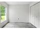 Bedroom featuring a window with a view of the front yard and a built-in closet at 1725 Bondurant Way, Brandon, FL 33511