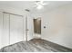 This cozy bedroom features a ceiling fan and closet for storage at 1725 Bondurant Way, Brandon, FL 33511