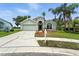 Charming single-story home featuring a well-manicured lawn, mature palms, and attached two-car garage at 1725 Bondurant Way, Brandon, FL 33511