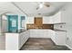Modern kitchen with white cabinetry, granite counters, and sleek hardware at 1725 Bondurant Way, Brandon, FL 33511