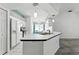 Kitchen island with seating, sink, and view of the breakfast nook and appliances at 1725 Bondurant Way, Brandon, FL 33511