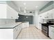 Spacious kitchen with ample counter space, white cabinets, and modern appliances at 1725 Bondurant Way, Brandon, FL 33511