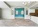 This beautiful living room features neutral paint, gray flooring, and an arched entry at 1725 Bondurant Way, Brandon, FL 33511