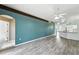 Open-concept living room featuring modern flooring, an inviting layout, and a seamless flow to the kitchen at 1725 Bondurant Way, Brandon, FL 33511