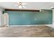 Spacious living room boasting modern flooring and a ceiling fan, offering plenty of natural light at 1725 Bondurant Way, Brandon, FL 33511
