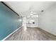Inviting living room with modern flooring, open layout, and view into the kitchen, perfect for entertaining at 1725 Bondurant Way, Brandon, FL 33511