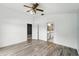 This bright main bedroom has a fan, and a doorway to the main bathroom at 1725 Bondurant Way, Brandon, FL 33511