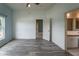 Bright main bedroom with wood-look floors and an ensuite bathroom, offering comfort and convenience at 1725 Bondurant Way, Brandon, FL 33511