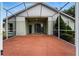 Screened patio featuring brick flooring and ample space for outdoor seating and entertaining at 1725 Bondurant Way, Brandon, FL 33511