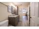 Tastefully designed bathroom with a modern vanity and convenient access to the kitchen area at 17544 Fairmeadow Dr, Tampa, FL 33647