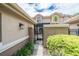 Charming gated entrance leading to a cozy home with well-maintained landscaping and a tile roof at 17544 Fairmeadow Dr, Tampa, FL 33647