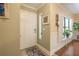 Inviting foyer with hardwood floors, window with shutters, and stylish decor at 17544 Fairmeadow Dr, Tampa, FL 33647