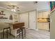 Charming kitchen area with island seating and a ceiling fan at 17544 Fairmeadow Dr, Tampa, FL 33647