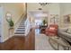 Inviting entryway and living room featuring hardwood floors and plenty of natural light at 17544 Fairmeadow Dr, Tampa, FL 33647