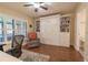 Bright office with a built-in murphy bed and ample storage, perfect for a flexible living space at 17544 Fairmeadow Dr, Tampa, FL 33647