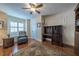 Charming home office space with a cozy chair and a classic wooden desk for a productive atmosphere at 17544 Fairmeadow Dr, Tampa, FL 33647