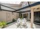 Outdoor patio with seating and a covered area perfect for dining and entertaining at 17544 Fairmeadow Dr, Tampa, FL 33647