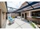 Inviting covered patio with comfortable seating, ideal for outdoor entertaining and relaxation at 17544 Fairmeadow Dr, Tampa, FL 33647