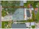 Aerial view of the house with its swimming pool, patio area, and surrounding yard space at 1878 New Hampshire Ne Ave, St Petersburg, FL 33703