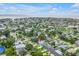 Aerial view of the house, showcasing its location within a neighborhood near the wide body of water at 1878 New Hampshire Ne Ave, St Petersburg, FL 33703