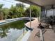 Picture of the outdoor swimming pool with surrounding patio area and lush landscaping at 1878 New Hampshire Ne Ave, St Petersburg, FL 33703