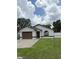 Charming single-story home showcasing a well-maintained lawn and a classic architectural style at 1900 W Kirby St, Tampa, FL 33604