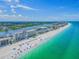Beautiful aerial view of the beachfront condo with crystal ocean waters and sandy white beaches at 20002 Gulf Blvd # 2803, Indian Shores, FL 33785