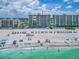 Stunning aerial view of resort with beach access and blue ocean water at 20002 Gulf Blvd # 2803, Indian Shores, FL 33785