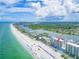 Sweeping aerial view showcasing the beachfront community with expansive shoreline at 20002 Gulf Blvd # 2803, Indian Shores, FL 33785