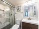 Modern bathroom boasts a glass-enclosed shower with marble tiling and sleek fixtures at 20002 Gulf Blvd # 2803, Indian Shores, FL 33785
