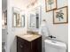 Well-lit bathroom features a granite vanity, large mirror, and convenient layout at 20002 Gulf Blvd # 2803, Indian Shores, FL 33785