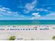 Expansive view of the sandy beach, turquoise ocean, and blue skies from this property at 20002 Gulf Blvd # 2803, Indian Shores, FL 33785