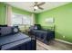 Bright bedroom featuring twin beds, blue accents, and views of the ocean from the window at 20002 Gulf Blvd # 2803, Indian Shores, FL 33785