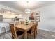 Stylish dining area with seating for six overlooking the kitchen and hallway area at 20002 Gulf Blvd # 2803, Indian Shores, FL 33785