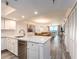 This open-concept kitchen features stainless steel appliances, granite countertops and opens into the living area at 20002 Gulf Blvd # 2803, Indian Shores, FL 33785