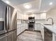 Well-lit kitchen with stainless steel appliances and white cabinets offers a clean, modern look at 20002 Gulf Blvd # 2803, Indian Shores, FL 33785